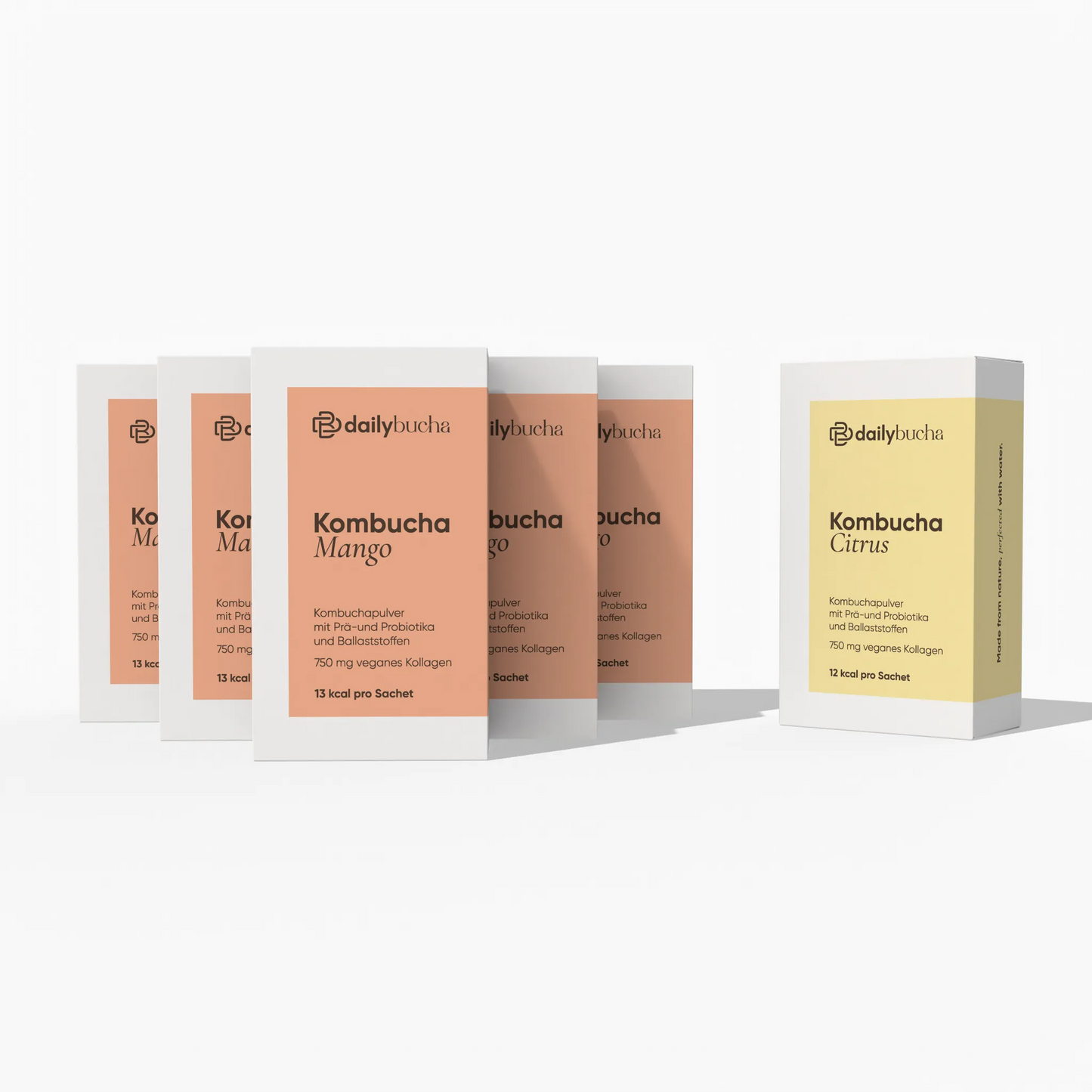 Daily Bucha Daily Rituals Set mit fünf Mango-Kombucha Boxen und einer Zitronen-Kombucha Box - Vorderseite der Verpackungen