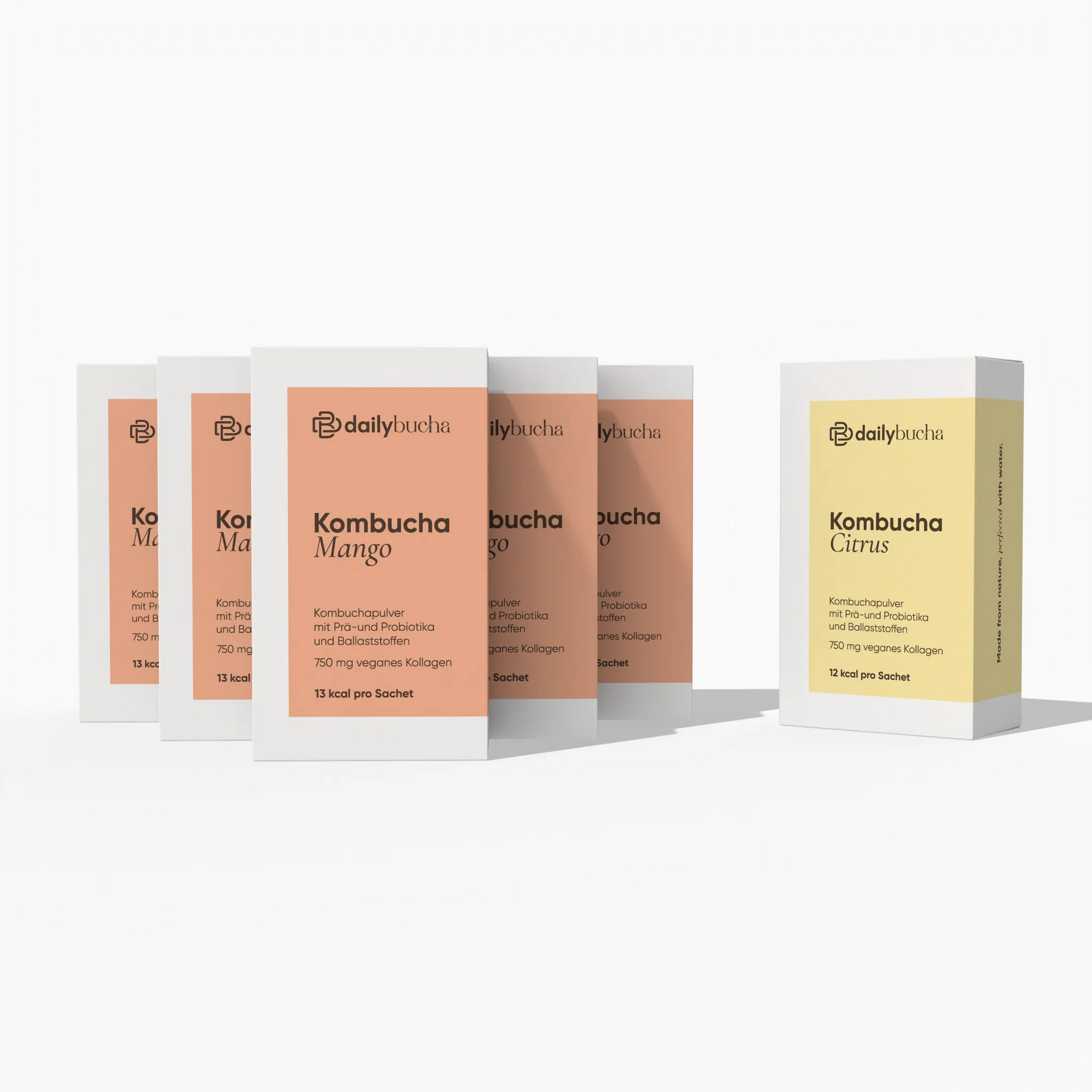 Daily Bucha Daily Rituals Set mit fünf Mango-Kombucha Boxen und einer Zitronen-Kombucha Box - Vorderseite der Verpackungen